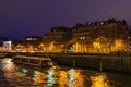 PARIS - DECEMBER 22, 2017: Night traffic in Paris on the boulevard and on the rive