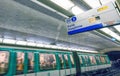 PARIS - DECEMBER 2012: Train moves inside a subway station. Paris Metro is the fastest way to move across the city