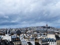 Paris downtown buildings over Montmartre Sacre Coeur Cathedral Royalty Free Stock Photo