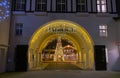 Entrance arch of modern french Paddock shopping outlet center with christmas tree, decoration and night lighting