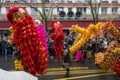 Chinese New Year, parade of dragon dance celebration the Dragon year in the thirteen district of Paris under a rain