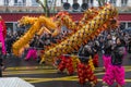 Chinese New Year, parade of dragon dance celebration the Dragon year in the thirteen district of Paris under a rain