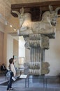 Asian young woman looking around the Louvre Museum and appreciating the beauty of a work of art.