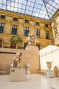 Ancient sculpture in Cour Marly room inside the Louvre Museum, Paris, France, Europe. April 2019