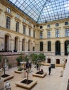 Ancient sculptures in the inner hall of Louvre museum. Paris France