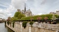 Paris, France, April 1, 2017: Apse of Notre-Dame de Paris and La fontaine de la Vierge from Square Jean-XXIII. Built in Royalty Free Stock Photo