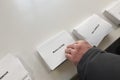 PARIS, FRANCE - APRIL 10, 2022 :Ballots with the names of candidates for the presidential elections in France