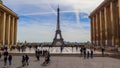 Paris / France - April 05 2019: Beautiful view of Eiffel Tower and cityscape from Trocadero. People at sweeping plaza of the