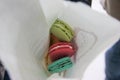 Paris, France - april 2016: Macarons cookies from Laduree store in paper bag in the Charles de Gaulle Airport