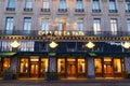 The famous cafe de la Paix located near opera house -Garnier palace in Paris, France. It had been inaugurated on May 5th Royalty Free Stock Photo