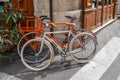 Paris, France, April 1, 2017: Old style bicycle in front of the Paris restaurant. Typical French street in Montmartre Royalty Free Stock Photo