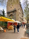 people passing food stalls and market in paris