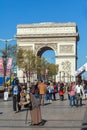 PARIS, FRANCE - APRIL 7, 2011: People walking in front of Arc de Royalty Free Stock Photo