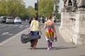 Paris, France - April 11, 2011: Pretty Female Musicians Walking Down