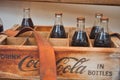 Paris, France, April, 2019 Some vintage Coca Cola bottles in a vintage carrier in a closeup Royalty Free Stock Photo