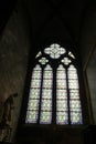 Paris, France - April 1, 2019: Stained glass window inside the Notre Dame Cathedral, Paris, France Royalty Free Stock Photo