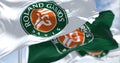 Three flags with the Roland-Garros logo waving in the wind