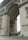 Paris, France - April 2, 2019: tourists under the Arc de Triomphe Triumphal Arch in Champs Elysees. Royalty Free Stock Photo