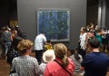 Paris, France - August 29, 2019: Crowd of visitors near the Blue Water Lilies, 1916Ã¢â¬â1919 by Claude Monet painting in Museum d`