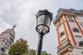 Dome of Sacre Coeur Basilica, a classical lampost and building o