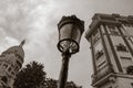 Dome of Sacre Coeur Basilica, a classical lampost and building o