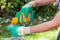 Paris, France - August 15, 2018 : Gardener using Roundup herbicide in a french garden. Roundup is a brand-name of an herbicide con Royalty Free Stock Photo