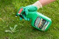 Paris, France - August 15, 2018 : Gardener using Roundup herbicide in a french garden. Roundup is a brand-name of an herbicide con Royalty Free Stock Photo