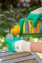 Paris, France - August 15, 2018 : Gardener using Roundup herbicide in a french garden. Roundup is a brand-name of an herbicide con Royalty Free Stock Photo