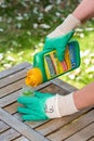 Paris, France - August 15, 2018 : Gardener using Roundup herbicide in a french garden. Roundup is a brand-name of an herbicide con Royalty Free Stock Photo