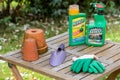 Paris, France - August 15, 2018 : Herbicide on a wooden table in a french garden. Roundup is a brand-name of an herbicide containi