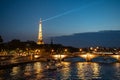 Illuminated Bridge Pont Des Invalides Over River Seine And View To Eiffel Tower In The Night In Paris, France Royalty Free Stock Photo