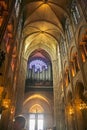 PARIS, FRANCE - August 16, 2018 - interior of the Notre Dame cathedral with suggestive arches and illuminated vaults and gothic Royalty Free Stock Photo