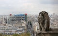 Paris, France - August 20, 2018: Statue of Chimera in Basilica of Notre Dame and the modern Pompidou Center