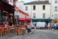 Street scene with traditional outdoor cafes in Montmartre, Paris Royalty Free Stock Photo