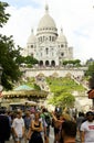 Tourists are walking in front of the Sacre-Coeur Basilica, Montmartre, Paris, France. Royalty Free Stock Photo