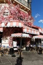 The traditional French cafe Favorite decorated with flowers . It located at famous Rivoli street in Paris, France. Royalty Free Stock Photo