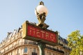 Paris, France. August 2022. Traditional Paris metro sign with buildings in the background Royalty Free Stock Photo