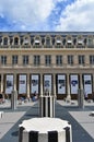 The Palais Royal, view of art installation Les Deux Plateaux, Colonnes de Buren, in the courtyard. Paris, France. Royalty Free Stock Photo