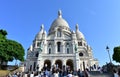 Basilique du Sacre Coeur with tourists and blue sky. Paris, France. Royalty Free Stock Photo