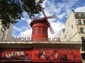 Paris, France - August 13, 2014: The windmill and entrance to club Moulin Rouge in Paris, France Royalty Free Stock Photo