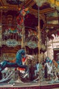 PARIS, FRANCE, 08.03.2022 Children`s circular carousel with horses in Paris to Montmartre near the Basilica Church