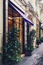 Parisian architecture and historical buildings, restaurants and boutique stores on streets of Paris, France