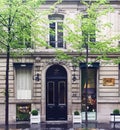 Parisian architecture and historical buildings, restaurants and boutique stores on streets of Paris, France