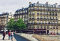 Parisian architecture and historical buildings, restaurants and boutique stores on streets of Paris, France Royalty Free Stock Photo