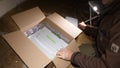 Unboxing unpacking parcel box with new Festool device in Systainer