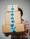 Woman with Amaozn Prime cardboard parcels in hands