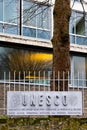 Paris, France - DEC 03, 2021: The logo of the UNESCO on fence the United Nations Educational, Scientific and Cultural Organization