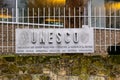 Paris, France - DEC 03, 2021: The logo of the UNESCO on fence the United Nations Educational, Scientific and Cultural Organization