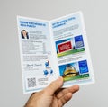 Man holding PayBack leaflet flyer Royalty Free Stock Photo