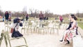 PARIS, FRANCE - DECEMBER, 31, 2016. Asian wedding photographer at work. Chinese couple posing in the Parisian park